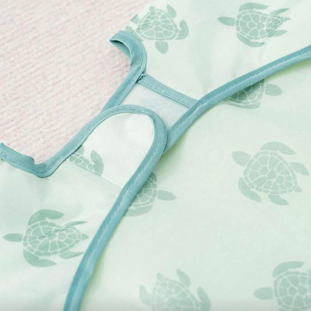 Babero impermeable con mangas