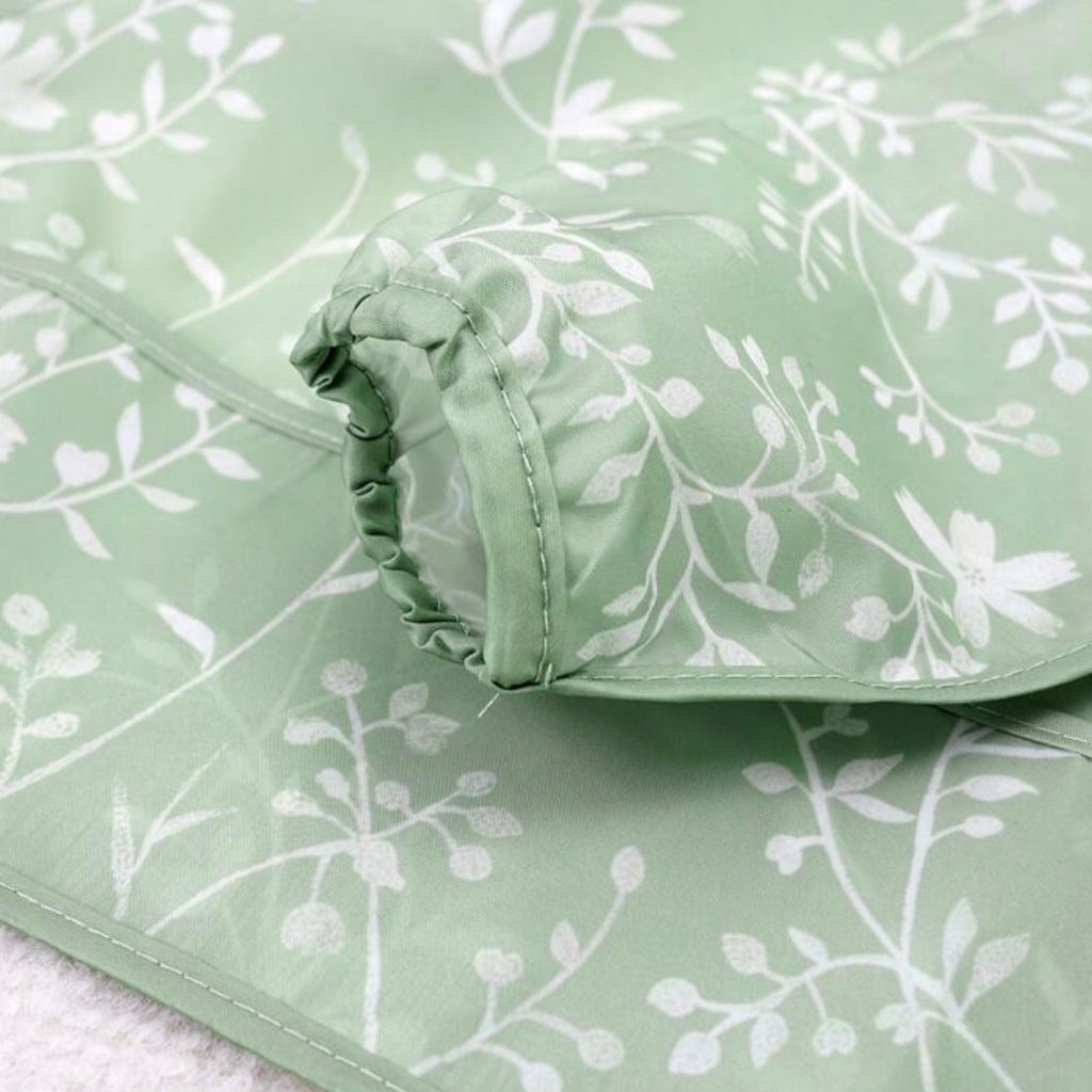 Babero impermeable con mangas