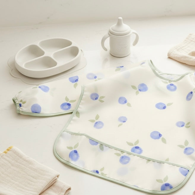 Babero impermeable con mangas